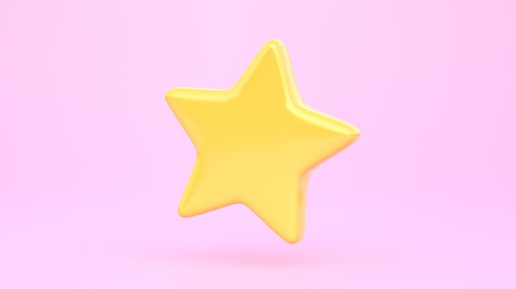 using positive reinforcement on your toddler, gold star on pink background